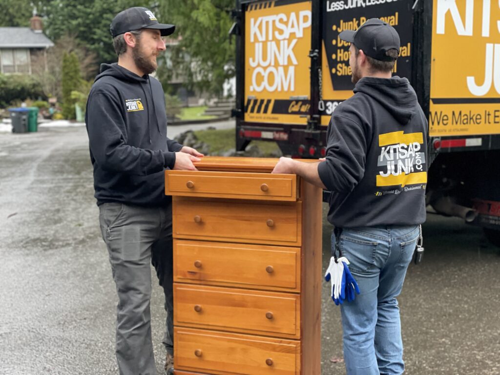 Kitsap Junk Removal pros hauling furniture to a junk truck
