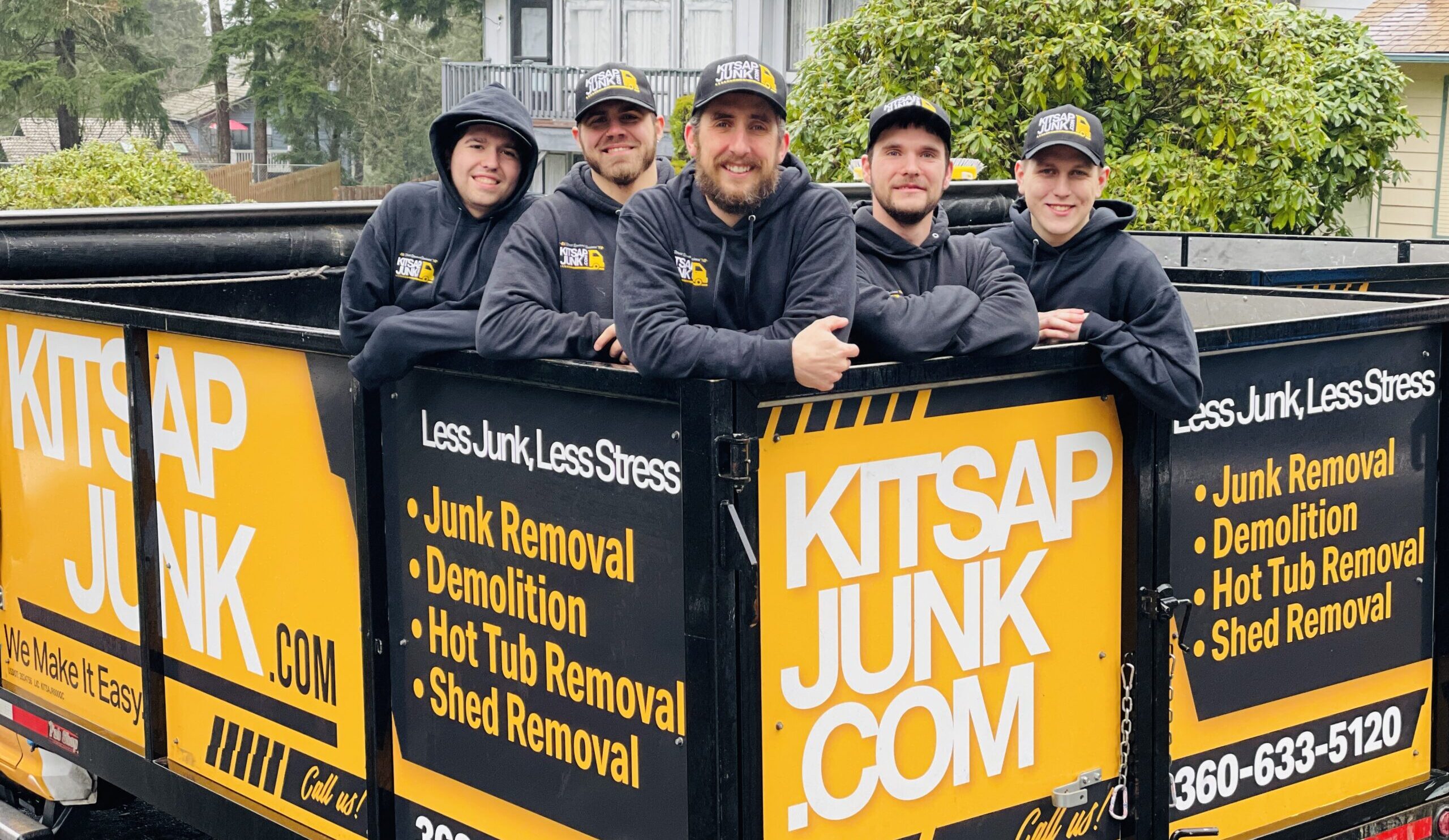 Kitsap Junk Removal crew posing in the back of the truck